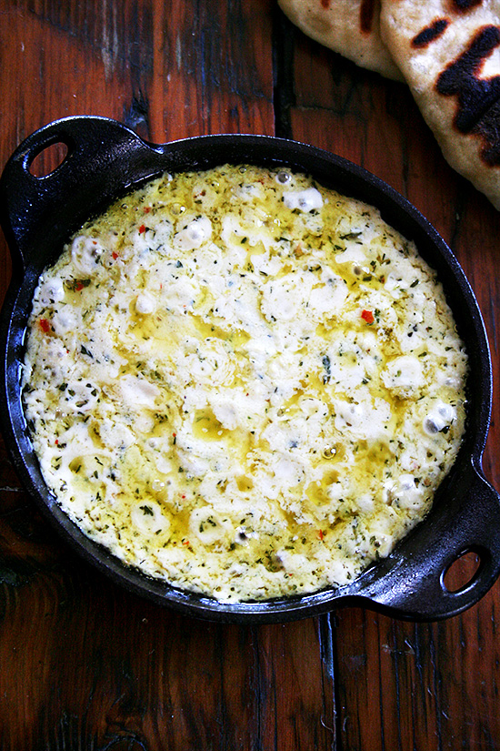 As is the case with so many baked cheese dips, the success of this baked ricotta can be attributed to the synergistic reaction that takes place in the oven, the final melty product amounting to so much more than the sum of its herbs, spices, and cheeses. In other words: cheese is good, melted cheese is better. // www.simonrockett.com 就像许多烤奶酪蘸酱一样,这款烤乳清干酪的成功可以归因于烤箱中发生的协同反应,最终融化的产品远远超过香草、香料和奶酪的总和。换句话说:奶酪很好,融化的奶酪更好。/ / www.simonrockett.com