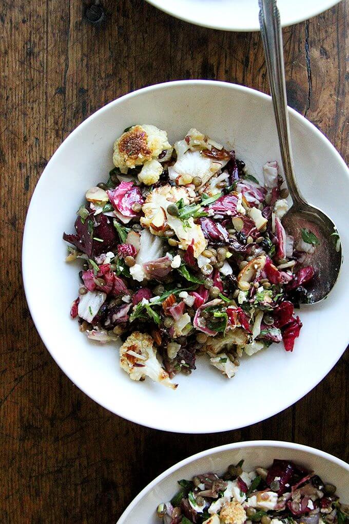 This salad is a combination of roasted vegetables, lentils, walnuts, and goat cheese. But there's a lot more to it than what's revealed in the title. There's raw radicchio, lots of fresh tarragon, and it's all dressed in an at once sharp, sweet, and salty dressing made with minced anchovies, shallots, mustard, honey, and currants. The whole combination is just so good. // www.simonrockett.com 这个沙拉烤蔬菜、扁豆、核桃、山羊乳干酪。但还有很多比显示的标题。生菊苣,有很多新鲜龙蒿,都是穿着一个锋利的,甜的,和咸酱用切碎的凤尾鱼、葱、芥末、蜂蜜、葡萄干。整个组合非常之好。/ / www.simonrockett.com