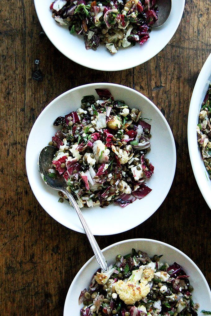 This salad is a combination of roasted vegetables, lentils, walnuts, and goat cheese. But there's a lot more to it than what's revealed in the title. There's raw radicchio, lots of fresh tarragon, and it's all dressed in an at once sharp, sweet, and salty dressing made with minced anchovies, shallots, mustard, honey, and currants. The whole combination is just so good. // www.simonrockett.com 这个沙拉烤蔬菜、扁豆、核桃、山羊乳干酪。但还有很多比显示的标题。生菊苣,有很多新鲜龙蒿,都是穿着一个锋利的,甜的,和咸酱用切碎的凤尾鱼、葱、芥末、蜂蜜、葡萄干。整个组合非常之好。/ / www.simonrockett.com